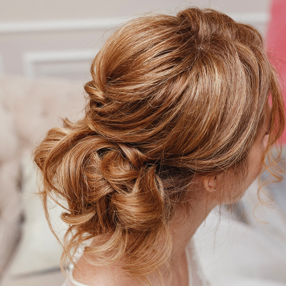 A deconstructed Chignon for a casual Bridal Hairstyle